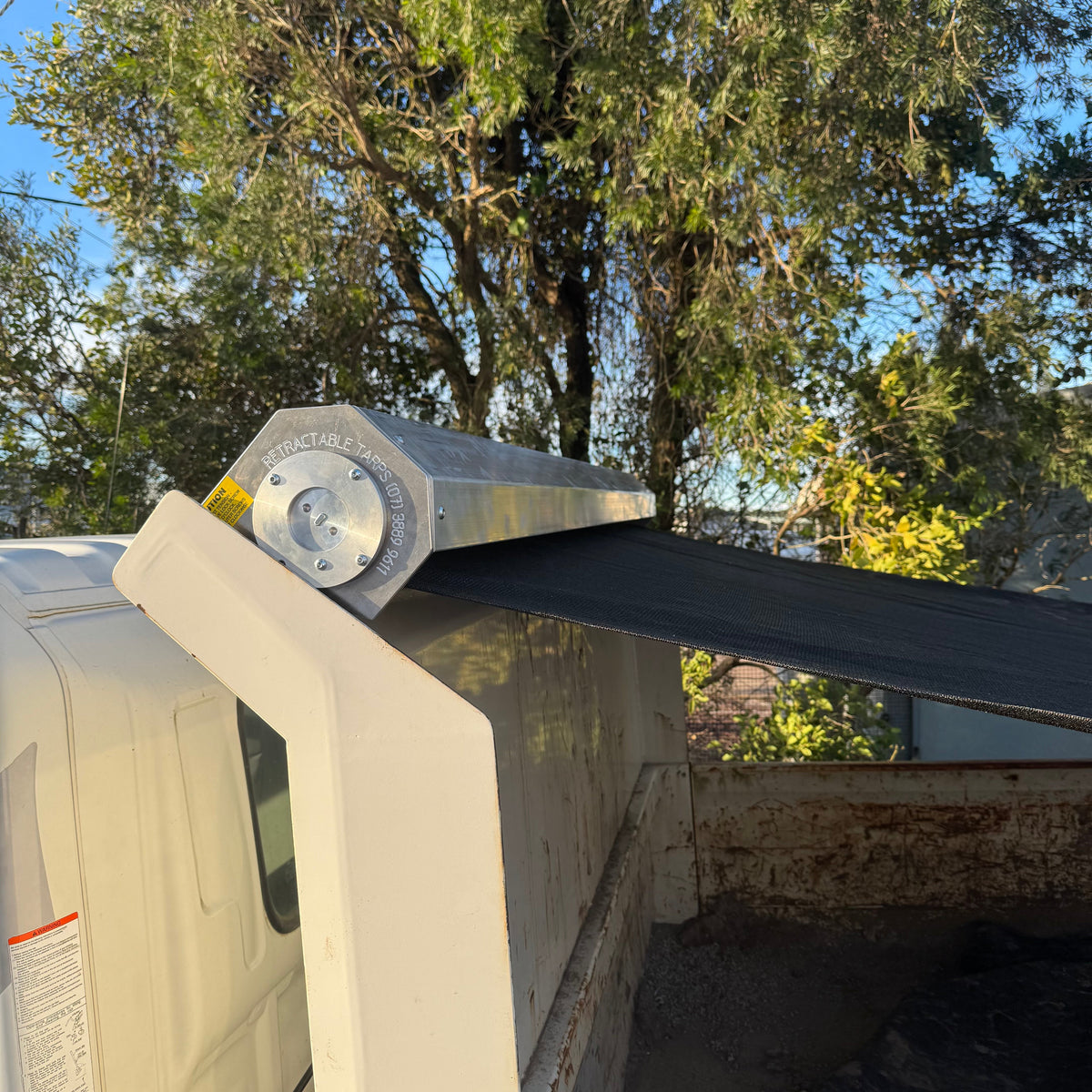 Spring-loaded pull tarp unit with Australian-made mesh tarp — this listing is for the replacement mesh tarp only