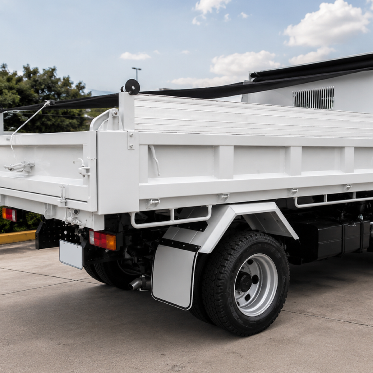 Illustrative image — aluminium hungry boards fitted above the sides of a light tipper body