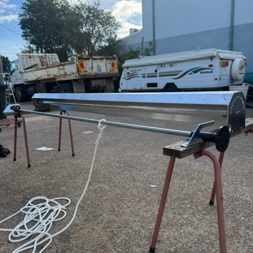 Bolt-on shark fin brackets for pull-out tarp system