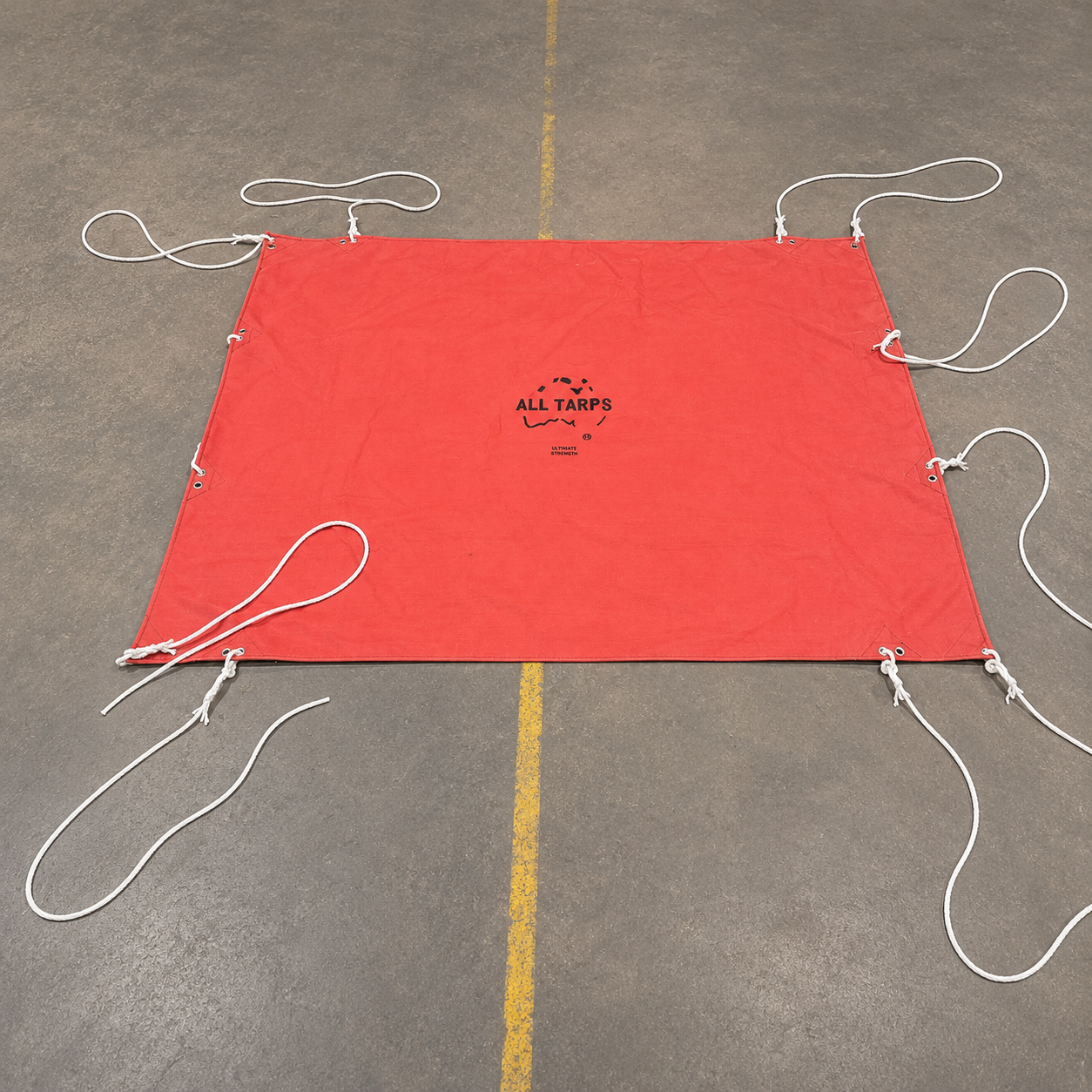 Red flat top trailer tarp cover with eyelets and silver ropes